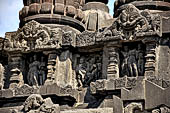 Prambanan - Candi Lara Jonggrang, miniature shrines surmounted by small fluted stupa with panels with musicians and dancers decorating the top of the balustrade 